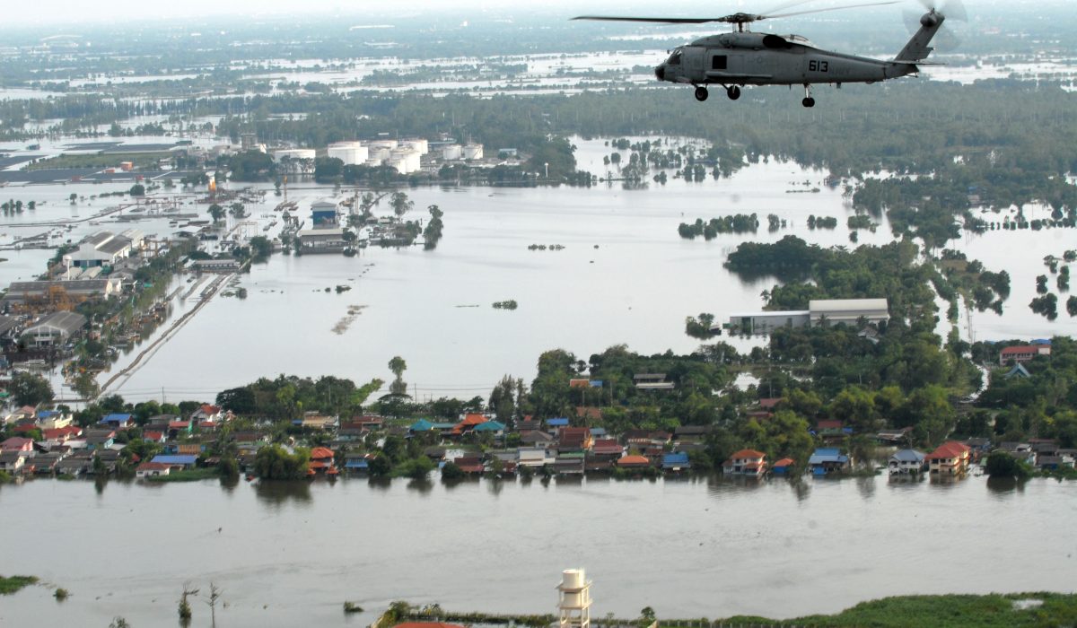 An SH-60F Sea Hawk helicopter assigned to Helicopter Anti-Submarine Squadron (HS) 14, flies around the Bangkok area with members of the humanitarian assessment survey team and the Royal Thai Armed Forces to assess the damage caused by flooding.